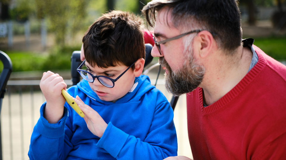 Image of a man teaching a child with special needs, representing tCaPc's commitment to fostering purpose.